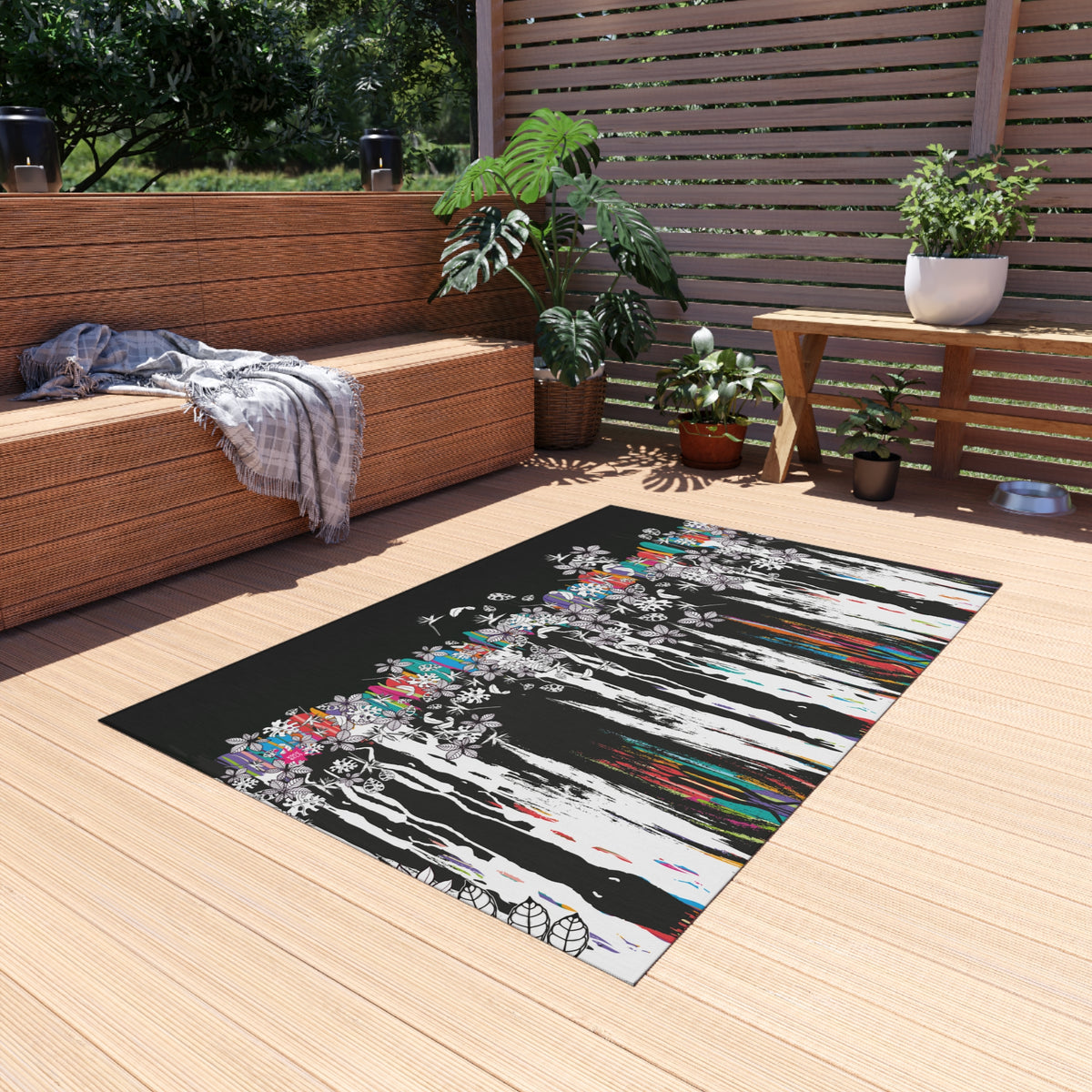 Alfombra con ilustración de hojas tropicales sobre fondo oscuro